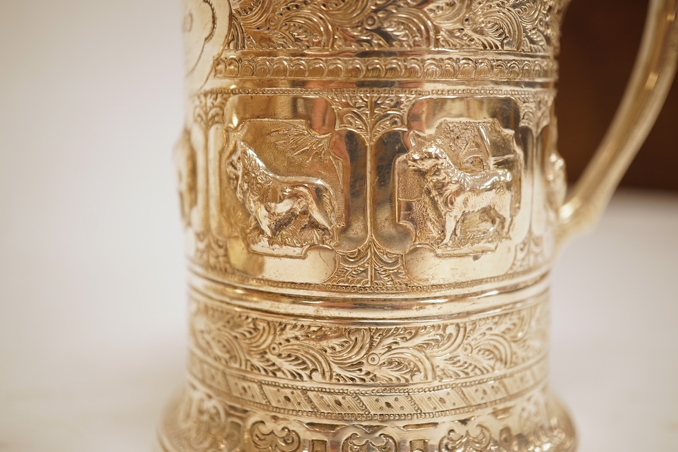 A George III silver baluster mug, Peter & Ann Bateman?, London, 1797, height 10.6cm, together with a late Victorian embossed silver christening mug, Glasgow, 1893, 12.2oz.